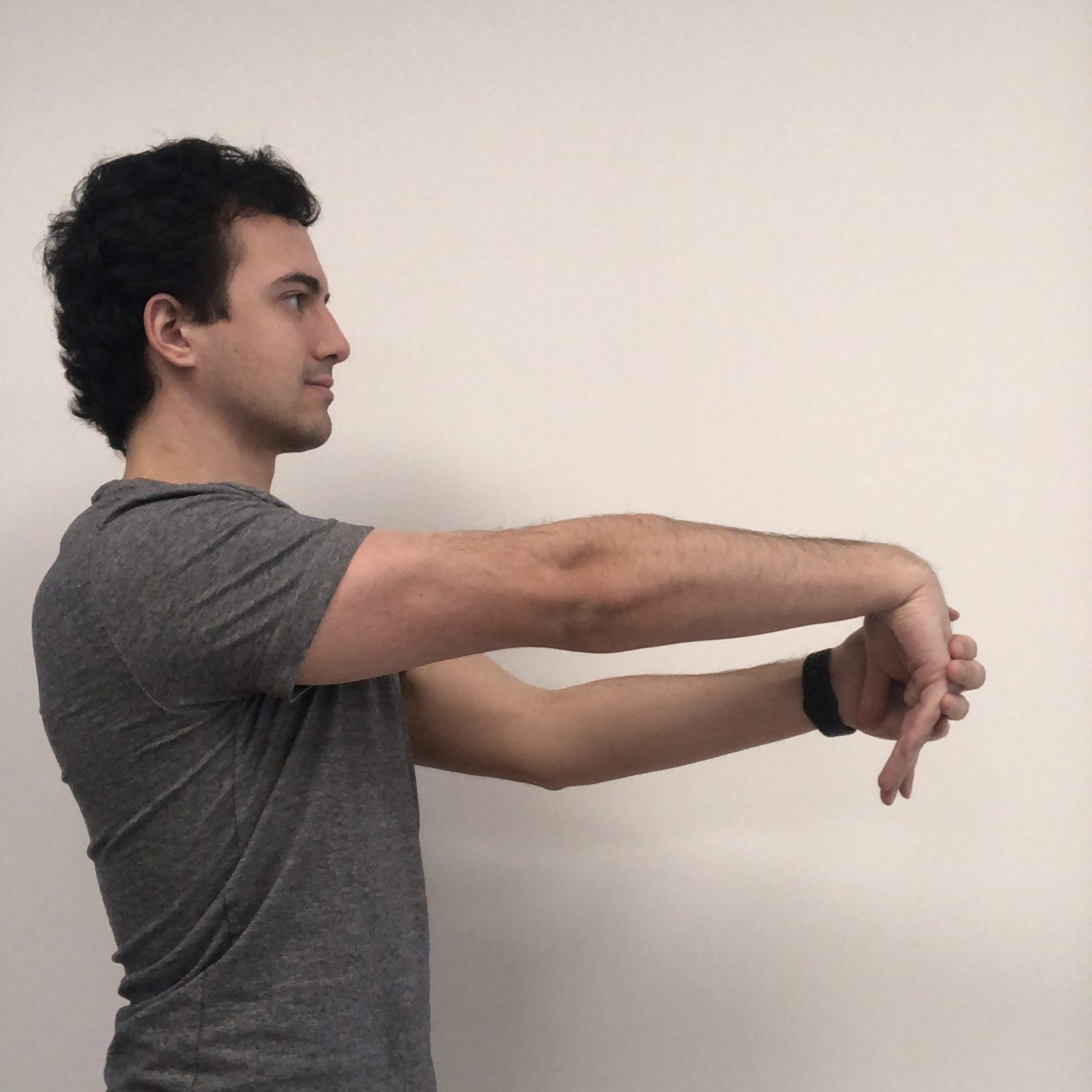 Man doing a stretch for tennis elbow